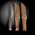 Vintage Handcrafted Knife Weapon With Intricate Carved Leather Sheaths And Metal Accents