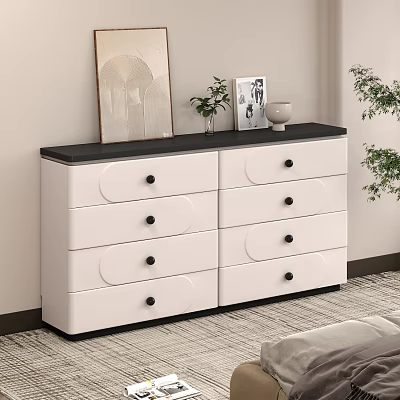 Modern White Chest of Drawers with Black Top Knobs and Decorative Items on Top 3d model