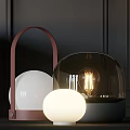 Modern Table Lamp With Black Glass Dome White Sphere And Glowing Visible Bulb