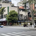 Modern Commercial Complex With Starbucks Glass Curtain Walls Red Tower Art Sculpture And Greenery