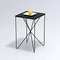 Modern Black Coffee Table With Metal Frame And White Plate Holding Yellow Lemon