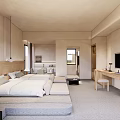 Modern Hotel Guest Room With White Bedding Wooden Headboard Desk TV And Natural Light