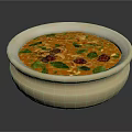 Fresh Orange Creamy Soup Topped With Green Herbs And Red Pieces In Ceramic Bowl