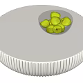 Round White Coffee Table With Ribbed Base And Glass Bowl Of Green Apples