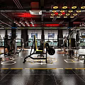 Modern Fitness Gym With Yellow Workout Machines Black Floor And Red Ceiling Lights