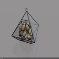 Glass Pyramid Shaped Decorative Ornament With Metal Frame Acorns Inside On Smooth Surface And Reflection