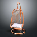 Orange Rattan Bird Nest Hanging Chair With White Cushion And Gray Background