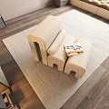 Modern Beige Modular Leisure Chair with Magazine on Seat and Light Rug on Wooden Floor