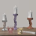 Colorful Candle Holders With Twisted Bases Crown Shaped Accents And Decorative Book