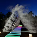 Outdoor Night Triangle Installation With Mist Colorful Steps Trees And Round Lights