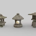 Traditional Japanese Stone Lanterns In Various Styles With Carved Patterns And Illuminated Glow