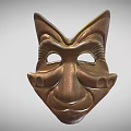 Intricately Carved Bronze Mask Featuring Detailed Facial Features And Decorative Motifs