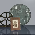 Gray Swing Door With Vintage Clock Wheel Decor And Photo Frame On Table