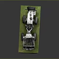 White Heavy Duty Off Road Vehicle with Large Tires on Green Platform