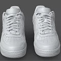 Pair of White Leather Low Top Sneakers With Lace Up Design And Comfortable Sole
