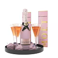 Pink And White Striped Frosted Cupcakes On Black Tray With Moet Champagne Bottle And Flutes