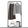 Clothes Set Featuring Brown Skirt White Knitted Cardigan Handbag And Polka Dot Bag On Rack