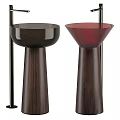 Two Modern Washbasins With Dark Brown And Red Bowls On Sleek Wooden Pedestals