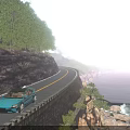 Scenic Coastal Road Along Cliff With Green Trees Blue Sky Blue Sea And Distant Ship