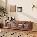 Wooden Brown TV Stand with Glass Doors Decorations and Potted Plant by Light Colored Wall