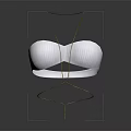 White Ribbed Bra Displayed On Gold Metal Stand Against Dark Background