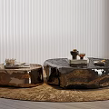 Modern Metallic Coffee Tables with Irregular Shapes and Decorative Items on Brown Rug
