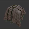 Household Item Covered With Brown Fabric And Cross Tied Black Straps On Wooden Pallet