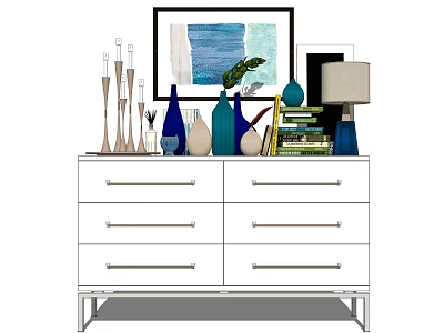 White Console Cabinet With Framed Artwork Candle Holders Vases Books Table Lamp And Green Plant 3d model