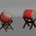 Traditional Red Musical Drums with White Drumheads on Wooden Stands for