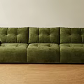 Green Three Seater Sofa With Modern Design And Plush Velvet Upholstery