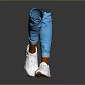 White Casual Sneakers Worn With Blue Pants On Legs Against Gray Reflective Floor