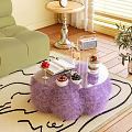 Glass Top Coffee Table With Purple Fluffy Base Open Book Wine Glass And Desserts