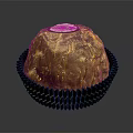 Delicious Round Chocolate With Golden Foil Wrapping And Label On Brown Paper Cup