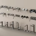 Various Styles of Modern Faucets Displayed on Wall and Countertop