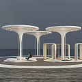 Modern Outdoor Seating Space With White Circular Canopies Supporting Pillars And Seats Near Water