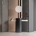 Sleek Black Cylindrical Washstand With Round Mirror Marble Countertop Decorative Plant And Gray Textured Walls
