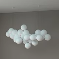 Unique Shaped Pendant Light With White Spheres Hanging In Modern Interior