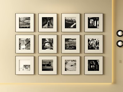 Black and White Framed Photo Wall with Multiple Artworks on Beige Interior Wall 3d model