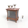 Wooden Display Cabinet with Glass Door Trophies on Top and One Trophy Fallen on Floor