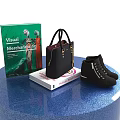 Decorative Accessories Display Set with Books Handbag and Boots on Blue Round Display Stand
