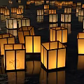 Numerous Elegant Square Decorative Lights With Traditional Patterns Floating On Water Surface Illuminated