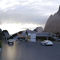 Scenic Mountain Entrance Gate With Misty Natural Surroundings And Cars On Driveway
