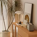 Wooden Decorative Cabinet With Drawers Glass Doors Near Palm Plant Table Lamp And Leopard Painting