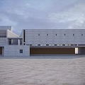 Modern Concrete Library Building with Geometric Design in Sandy Landscape Under Cloudy Sky