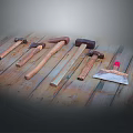 Different Types of Hammers and Putty Knife on Wooden Floor for DIY Projects
