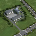 Large Industrial Factory Site With Main Building Green Grass Trees And Access Roadways