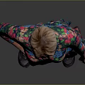Woman in Colorful Floral Dress Standing with One Hand on Hip Against Gray Background