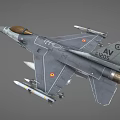 Military Fighter Jet With Gray Camouflage Paint Golden Nose Cone Mounted Missiles And Wing Markings