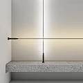 Modern Sleek Wall Lamp With Black Finish And Warm Light Above Stone Shelf