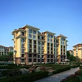 Modern Multistory Residential Building With Yellow Exterior Red Roof And Landscaped Garden